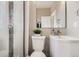 The bathroom features a shower, toilet, and modern vanity with sink at 2631 W 34Th Ave, Denver, CO 80211