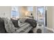 Cozy bedroom featuring natural light from the windows and a door to the exterior at 2631 W 34Th Ave, Denver, CO 80211