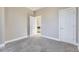 Well-lit bedroom with plush carpets and a view into another room via the open door at 2631 W 34Th Ave, Denver, CO 80211