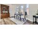 Elegant dining room with a classic cabinet, comfortable seating, and abundant natural light at 2631 W 34Th Ave, Denver, CO 80211