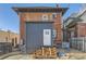 Exterior view of the rear of a brick building with a newly added deck and a modern gray addition at 2631 W 34Th Ave, Denver, CO 80211