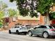 Quaint brick restaurant with prominent signage, complemented by modern vehicles parked nearby at 2631 W 34Th Ave, Denver, CO 80211