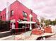 Vibrant brick building housing Park Burger, enhanced by outdoor seating and manicured landscaping at 2631 W 34Th Ave, Denver, CO 80211