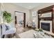 Charming living room featuring a decorative fireplace and an open view to the dining area at 2631 W 34Th Ave, Denver, CO 80211