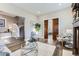 Bright and airy living room with hardwood floors, a cozy seating area, and a glimpse of the staircase at 2631 W 34Th Ave, Denver, CO 80211