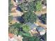 An aerial perspective of a green rooftop covered by trees and shrubs at 8820 Poze Blvd, Thornton, CO 80229