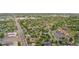 Aerial view of a suburban neighborhood with mature trees and proximity to retail at 8820 Poze Blvd, Thornton, CO 80229