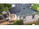 Aerial view of a house with nice green roof and beautiful yard at 8820 Poze Blvd, Thornton, CO 80229
