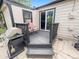 Back patio with a grill, chairs, and outdoor space for relaxation and entertainment at 8820 Poze Blvd, Thornton, CO 80229