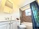 Cozy bathroom features a shower-tub, vanity, and natural light at 8820 Poze Blvd, Thornton, CO 80229