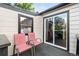 Cozy deck with two chairs and sliding glass door, perfect for relaxing outdoors and enjoying the natural light at 8820 Poze Blvd, Thornton, CO 80229
