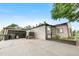 Exterior view of home with driveway and garage at 8820 Poze Blvd, Thornton, CO 80229