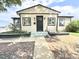 Charming single-story home with neutral siding and black trim, featuring a well-maintained front yard and inviting entrance at 8820 Poze Blvd, Thornton, CO 80229