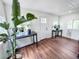 Inviting foyer with hardwood floors, bright natural light, and stylish decor at 8820 Poze Blvd, Thornton, CO 80229