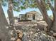 Beautiful home exterior with a rock garden, mature trees, and classic curb appeal at 8820 Poze Blvd, Thornton, CO 80229