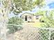Charming single-story home with black door and a fenced yard at 8820 Poze Blvd, Thornton, CO 80229