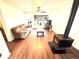 Inviting living room features wood-look floors, a cozy wood-burning stove, and a comfortable seating area at 8820 Poze Blvd, Thornton, CO 80229