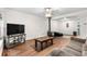 Spacious living room featuring wood floors, recessed lighting, and ample seating for relaxation at 8820 Poze Blvd, Thornton, CO 80229