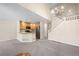 Open concept dining area with hardwood floors and kitchen island at 705 Snowberry St, Longmont, CO 80503