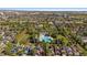 An aerial view showcases community pool and meticulously landscaped neighborhood at 2461 Spruce St, Denver, CO 80238