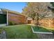 Landscaped backyard featuring a well-maintained lawn and small table at 2461 Spruce St, Denver, CO 80238