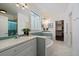 Bright bathroom features double sinks, tub, and teal mosaic tiles for a refreshing design at 2461 Spruce St, Denver, CO 80238