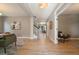 Bright hallway showcasing hardwood floors and an open floor plan with staircase at 2461 Spruce St, Denver, CO 80238