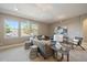 Comfortable living room featuring three large windows, neutral walls, and two sofas at 2461 Spruce St, Denver, CO 80238