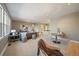 Open living room features neutral walls, modern lighting, and access to other rooms at 2461 Spruce St, Denver, CO 80238