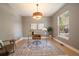 Bright home office with hardwood floors, a modern glass desk, and large window at 2461 Spruce St, Denver, CO 80238