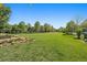 Expansive community park featuring open green spaces and mature trees at 2461 Spruce St, Denver, CO 80238