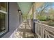 Inviting covered front porch with classic columns and overhead lighting at 2461 Spruce St, Denver, CO 80238