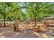 Charming town square with benches, lush trees, and inviting walkways at 2461 Spruce St, Denver, CO 80238