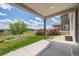 Back patio with a view of the green space and blue skies at 10506 Akron St, Commerce City, CO 80640