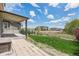 Backyard with a grass area and a view of neighborhood buildings at 10506 Akron St, Commerce City, CO 80640