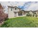 Spacious backyard features a well-maintained lawn and cozy covered patio area at 10506 Akron St, Commerce City, CO 80640
