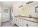 Bathroom with a glass-enclosed shower and a vanity with black hardware at 10506 Akron St, Commerce City, CO 80640