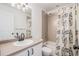 Bathroom featuring tub and shower combo, plus a white vanity at 10506 Akron St, Commerce City, CO 80640