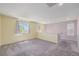 The bedroom has carpet and a window at 10506 Akron St, Commerce City, CO 80640