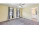 Bedroom features neutral walls, carpet, and an ensuite bathroom at 10506 Akron St, Commerce City, CO 80640