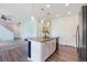 Open kitchen concept with island and seamless access to the living area at 10506 Akron St, Commerce City, CO 80640