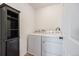 Laundry room features a side by side washer and dryer plus storage at 10506 Akron St, Commerce City, CO 80640