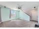 Spacious living room with carpet and stairs at 10506 Akron St, Commerce City, CO 80640