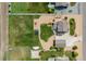 Aerial shot of property featuring large yard with recreational equipment and well-kept landscaping at 11343 E 163Rd Ct, Brighton, CO 80602
