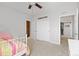 Bright bedroom with neutral walls, ceiling fan, closet and doorway views to other living spaces at 11343 E 163Rd Ct, Brighton, CO 80602