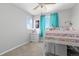 This cozy bedroom boasts natural light, and space decor with an adorable loft bed at 11343 E 163Rd Ct, Brighton, CO 80602