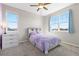 Bright bedroom with bed, dresser, large windows and neutral walls at 11343 E 163Rd Ct, Brighton, CO 80602