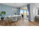 Modern dining room with stylish table, chairs, and sliding glass doors to the patio at 11343 E 163Rd Ct, Brighton, CO 80602