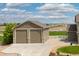 Spacious detached garage with a two-car garage, stone accents, and a driveway at 11343 E 163Rd Ct, Brighton, CO 80602