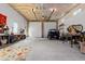 This large garage includes workbenches, storage shelves, and a vehicle for projects and hobbies at 11343 E 163Rd Ct, Brighton, CO 80602
